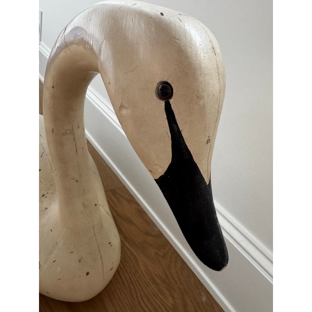 Striking large-scale antique wooden swan, hand carved and finished in a beautifully aged creamy white paint with a...