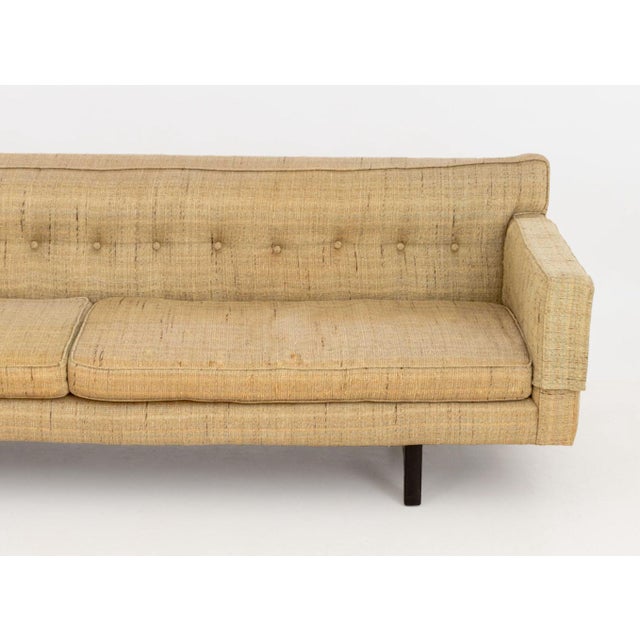 Edward Wormley for Dunbar Bracket Back Sofa, with tan and green woven wool on four ebonized taper wood legs. 28" H x 91" W...