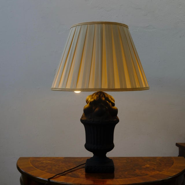 Beautiful table lamp, with a dark gray-black cast iron base, featuring natural decorations (fruit). Removable lampshade....