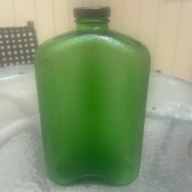 This is Hemingway Green Water Bottle that was made during the Depression to store water in the refrigerator in. It holds 2...