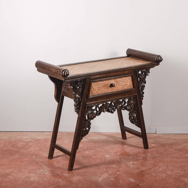 This oriental-style coffee table features an exotic wood structure, richly carved with stylised floral motifs and scrolls...