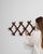 An early 20th century French coat hanger rack crafted in wood and designed in the faux bamboo style. The structure...