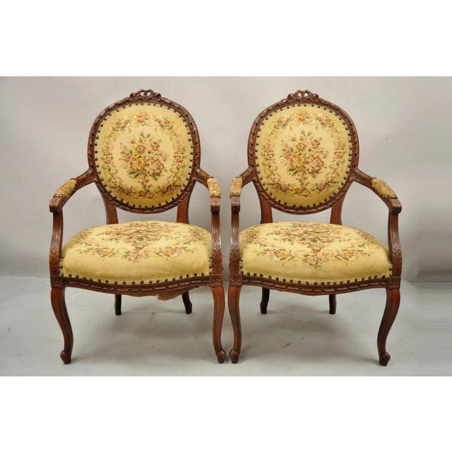 Antique French Country Louis XV Style Victorian Floral Tapestry Lounge Arm Chairs - a Pair. Item features ribbon and rose...
