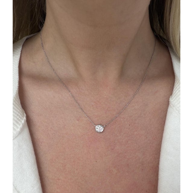 An exquisite Tiffany & Co. necklace designed by Elsa Perettii , showcasing a vibrant approximate 0.75 carat round...