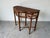 A beautifully crafted vintage demi-lune console table by Milling Road for Baker Furniture, featuring a rich bamboo frame...