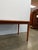 Authentic vintage mid century modern teak extendable dining table with 1 built-in leaf. This piece is in excellent overall...