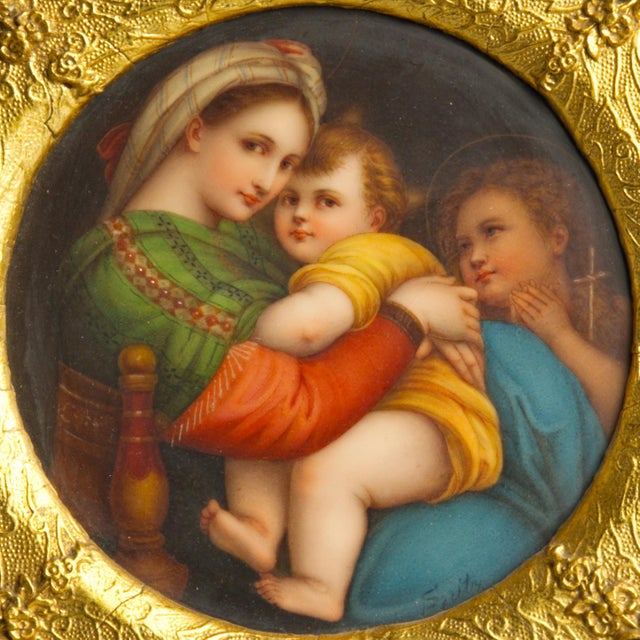 A jewel-box antique porcelain plaque after Raphael's beloved Madonna della Sedia, hand-painted and set into a dramatically...