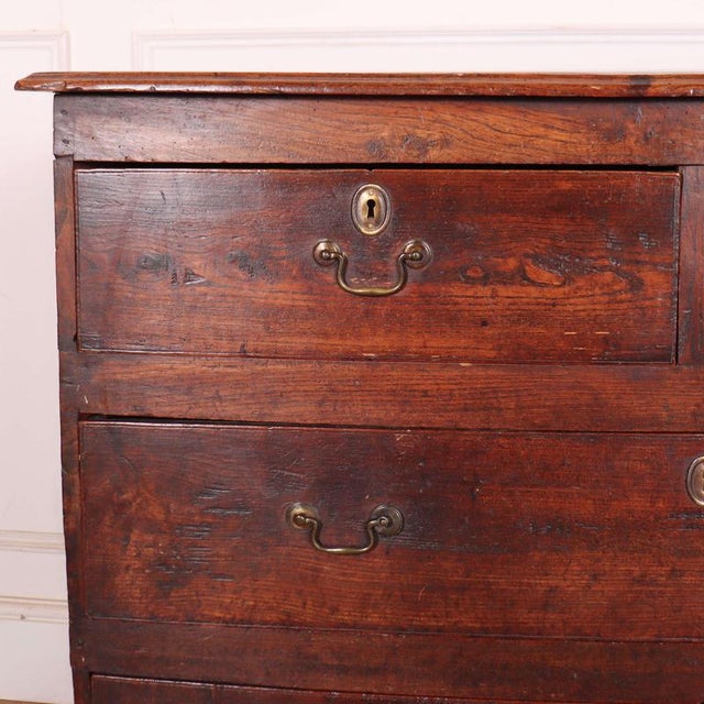 Late 18th Century English elm chest of drawers, lovely patina. 1950 This piece is designed in the style of the selected...
