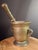 Exhibiting exceptional 18th-century scale and sculptural presence, this heavy solid cast brass mortar and pestle features...