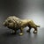 This finely detailed solid brass lion figurine brings a touch of the wild to your desk or shelf. The lion is depicted in a...