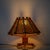 A low, broad pair of rattan table lamps from the French Riviera vogue of the 1960s. Each shade is stretched with Vienna...