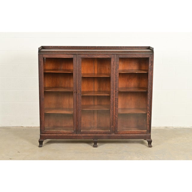 A gorgeous antique American Empire, Victorian, or Arts & Crafts bookcase cabinet In the manner of R.J. Horner & Co. USA,...