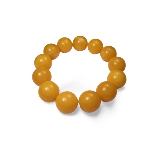 Antique natural Baltic amber bead slide-on bangle bracelet. This stunning piece features 13 natural perfectly round amber...
