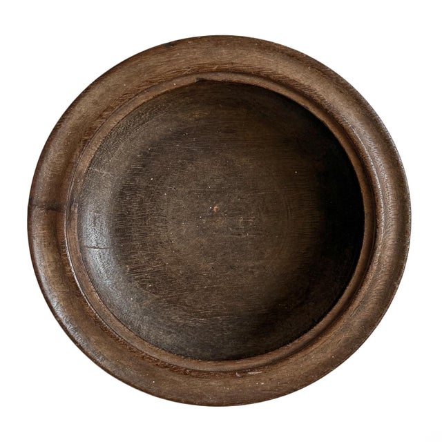 Original antique wood carved bowl from Mali. Features broad raised rim and hand-carved concentric detailing throughout its...