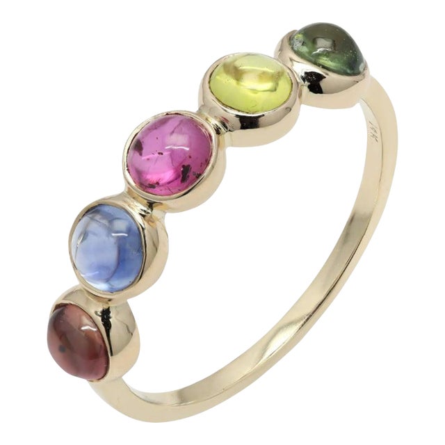 A 14K gold half eternity band set with several sapphires represents a couple's unwavering love. It demonstrates your...