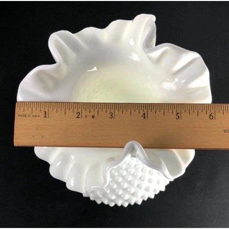Elegant vintage Fenton white milk glass hobnail vase featuring a beautifully ruffled and crimped edge. This larger...