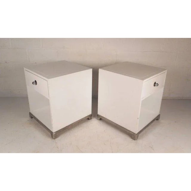 This beautiful vintage modern pair of end tables feature one drawer and a large compartment underneath. Sleek design with...