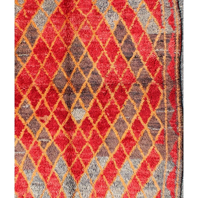 Mid 20th Century Midcentury Moroccan Rug With Orange, Red, Brown Diamonds and Blue Fringe Detail For Sale - Image 4 of 7