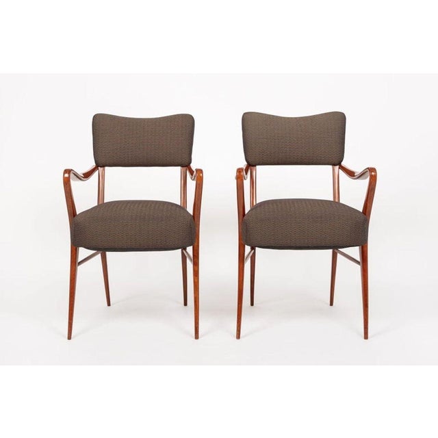 This beautiful pair of vintage mid century modern arm chairs attributed to mid century Italian designer Gio Ponti are...