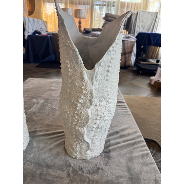 The unglazed white bisque porcelain material pairs perfectly with the crocodile skin texture on these vases. Handcrafted...