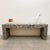 A striking 1980s Postmodern console with a bold architectural form and sculptural presence. The elongated rectangular top...
