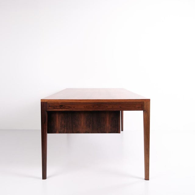Diplomat desk designed by Finn Juhl for France & Søn around 1961. Made in rosewood with a rectangular top and two...