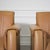 Fantastic pair of post modern styled club chairs featuring slab side legs and and tan leather upholstery. Very nice...