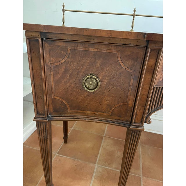 From Niagara Furniture, this vintage Heritage mahogany sideboard has both elegant details and richly grained wood....
