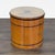 Biedermeier style round drum table with drawer and cabinet. The table has ebonized detail and brass hardware with a...