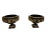 Pair of neoclassical black and gold classical cast iron urns. Spectacular pair with bow, garland and medallion decoration....