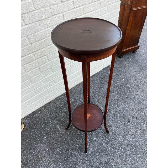 Antique Edwardian Sheraton Mahogany Inlaid Plant Stand Sculpture Pedestal Table. Well made, features slender legs and...