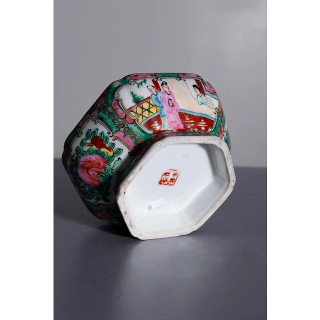 Explore the artistry and elegance of traditional Chinese craftsmanship with this stunning porcelain vase. Adorned with...