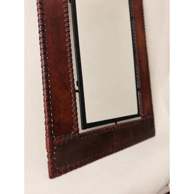 Hand-laced leather wrapped over an iron frame with solid brass finials. Acquired in Italy and believed to have been made...