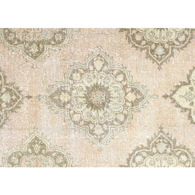 Hand-woven wool on wool foundation in Turkey's Oushak region, this 4'10" x 12'7"&nbsp;vintage rug exemplifies authentic...