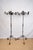 A pair of wrought iron candelabra, custom made in USA, late 20th century. Featuring six scrolled arms for pillar candles....