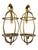 Striking vintage pair of Hollywood Regency-style gold rope candle lantern sconces. Each features an intricate twisted-rope...