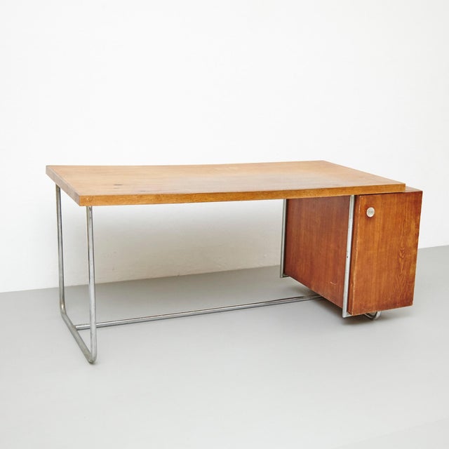 Bauhaus desk designed by unknown designer, circa 1930. Manufactured in Netherlands. Tubular structure, wood. This desk is...