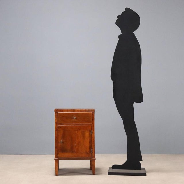 Directoire walnut bedside table, dating back to the early 19th century, from Italy. It features a drawer located under the...