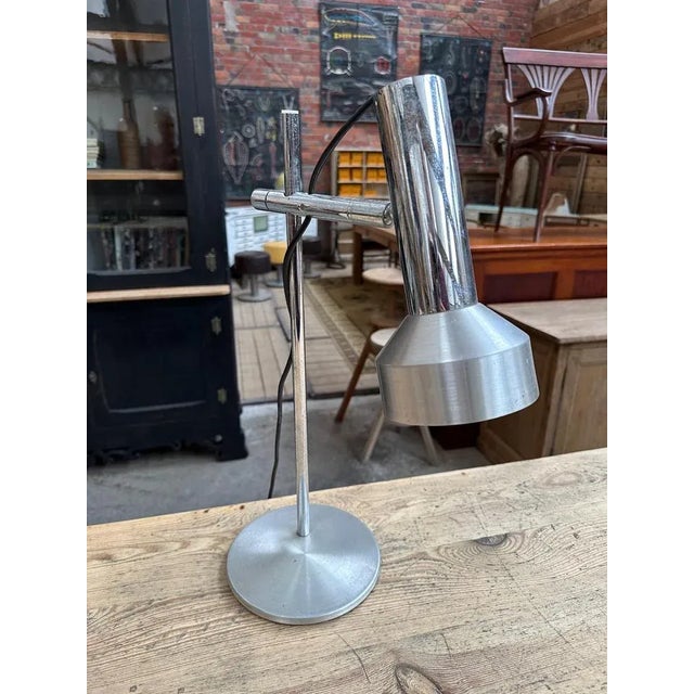 This lamp has a pretty patina it is functional. I have official proof of authenticity such as vintage catalogs, designer...