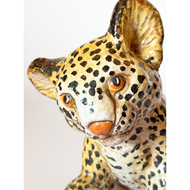 Charming hand painted vintage terracotta ceramic leopard cub, marked Italy. The details, warm glazes, and style are...