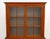 American South Cherry Jackson Press, 19th century, the top section with two glass-paneled doors opening to three shelves,...