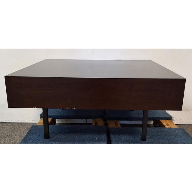 Bespoke coffee table produced by local LA furniture company featuring a wood table top and blackened steel legs. Used...