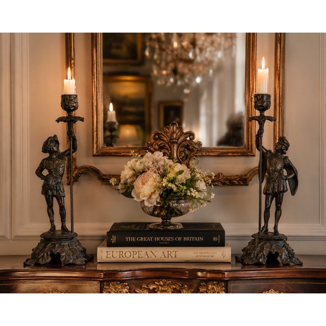 A striking pair of antique Victorian French figural candlesticks cast in spelter with a rich dark bronze patinated finish....