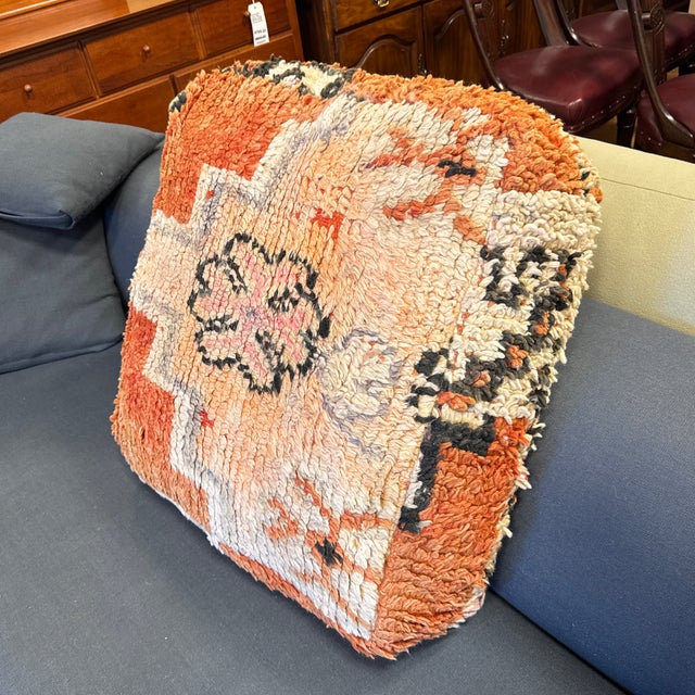 Design Plus Gallery presents a Moroccan Style Handwoven Floor Pillow. The pillow is covered in a handwoven textile with a...