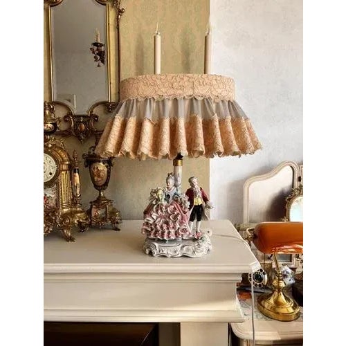 Vintage dresden porcelain bedside/table lamp. Video presentation. It comes with an elegant lampshade. The lamp is in a...