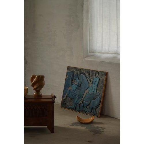 A beautiful mid-century modern wall relief panel featuring a dynamic figural composition rendered in sculptural low...