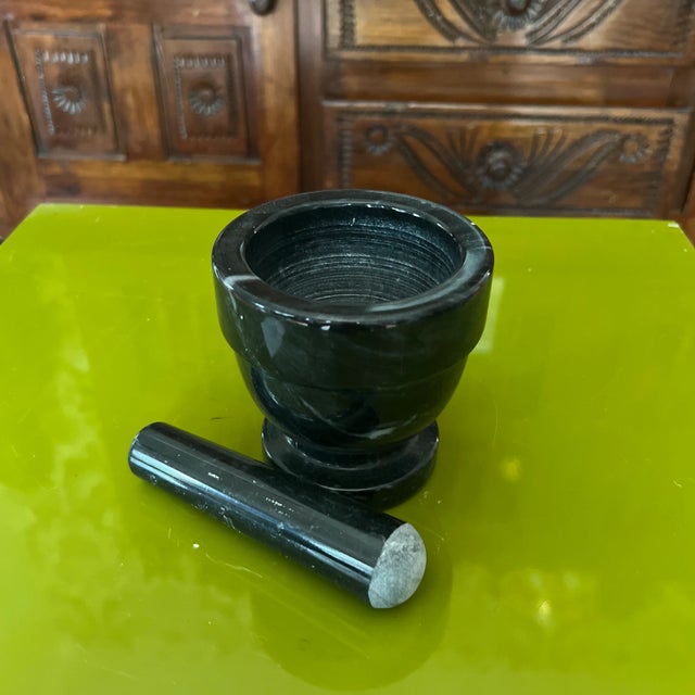 Delve into the timeless art of handcrafted pottery with a vintage marble mortar and pestle. For centuries, artisans have...