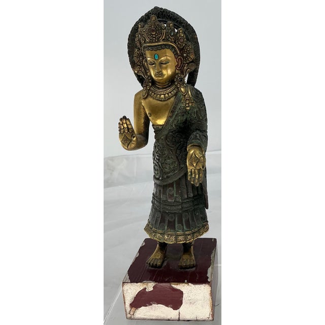 Great antique bronze Dipankara Buddha figure. Headpiece decorated with semi-precious stones.beautiful patina and details....
