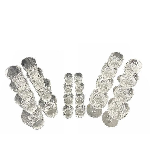 Crystal glasses of 24 pieces, set for 8. An english set of crystal glasses with diamond cut and oval pattern. Mid-20th...