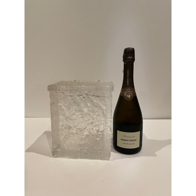 A fun ice bucket inspired by an ice block with Wilardy maker's mark. It is made from thick textured lucite. The handles...